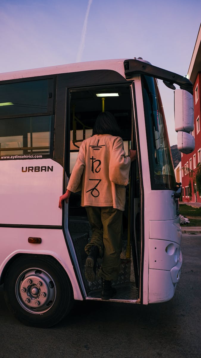 A Guy Boarding a Bus