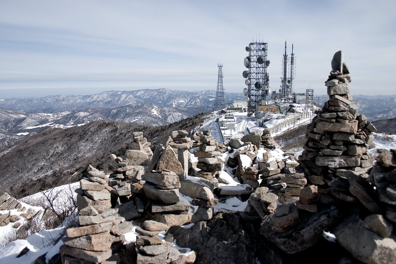 Communication system consisting of radio masts and telecommunication towers located on top of rocky highlands
