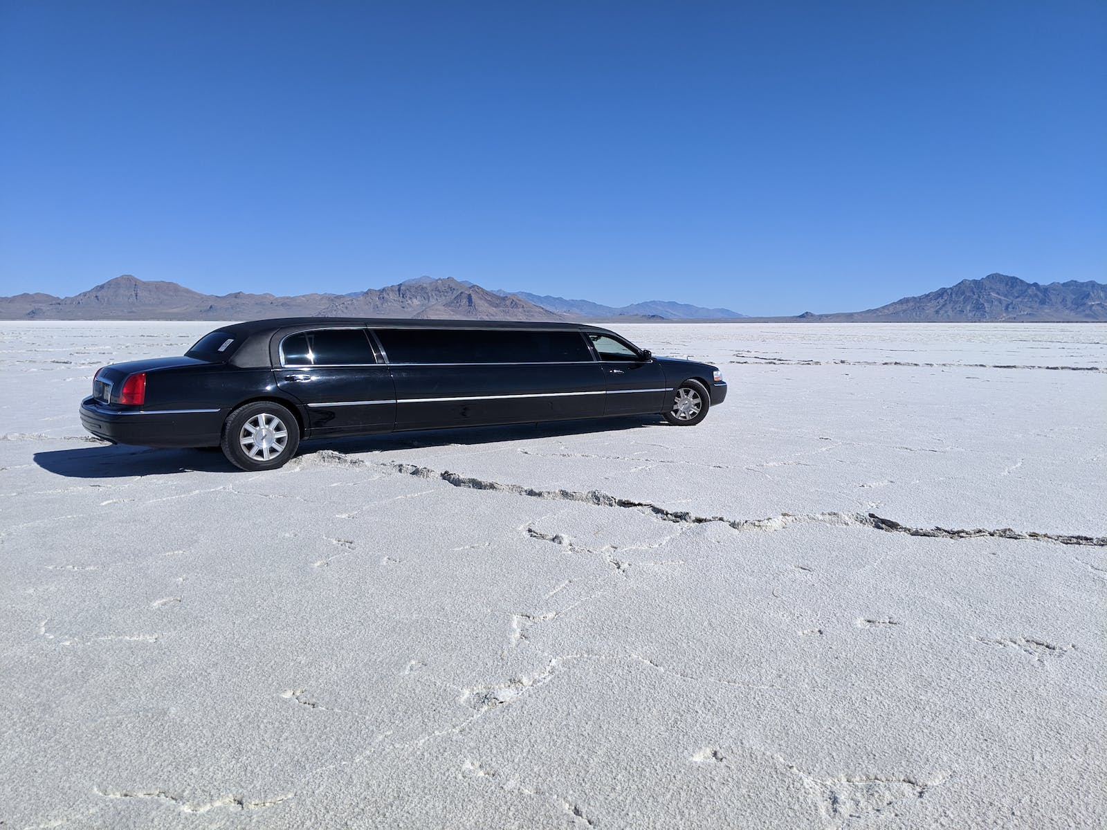 A Black Limo Parked on the Desert