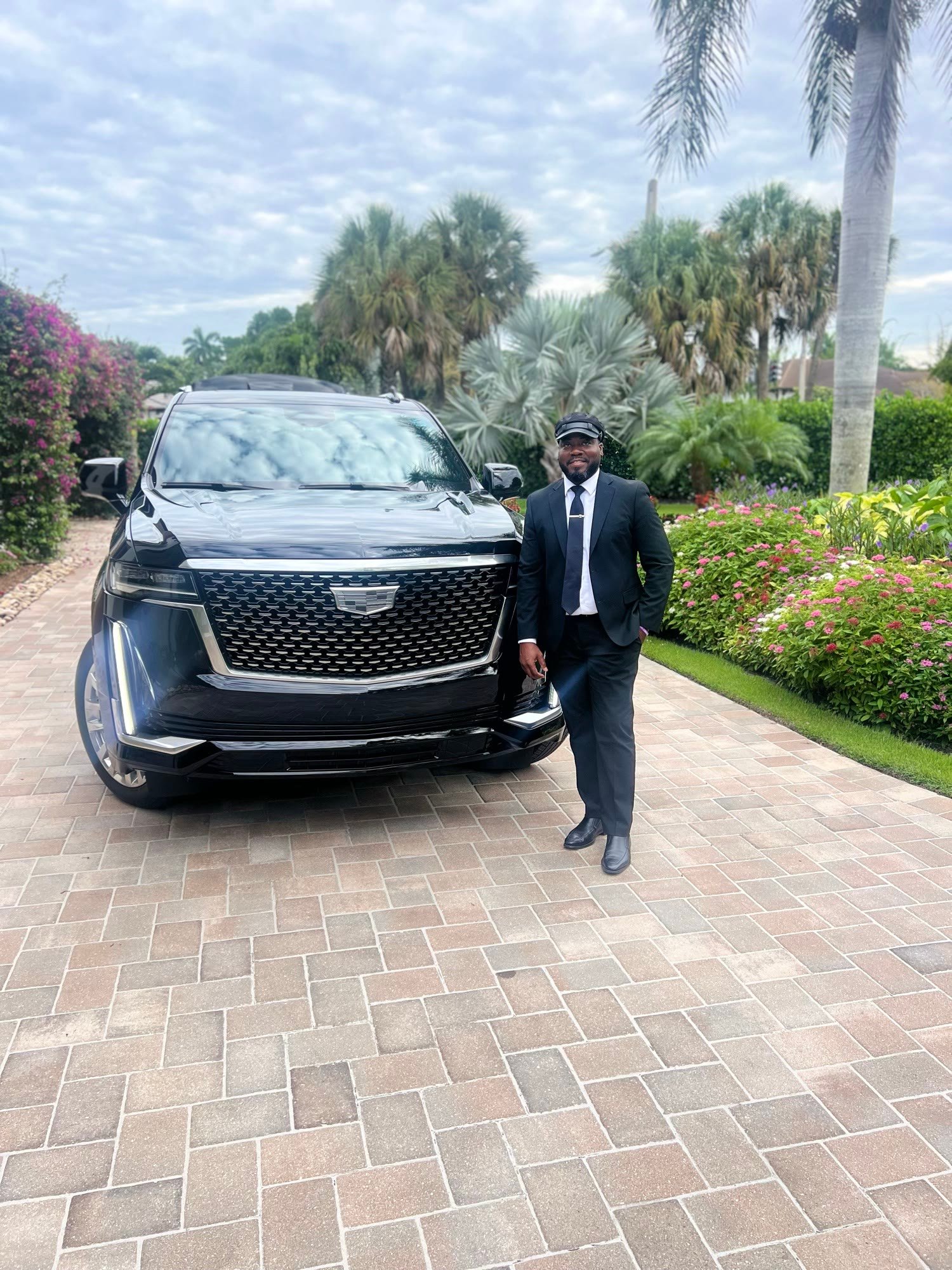 Private Independent Car Services chauffeur with a Cadillac SUV in Naples, Florida